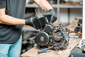 Workman Disassembling Motorcycle Engine During A Repairment At The Working Table Of The Workshop, Close Up With No Face, Diesel Parts, HD wallpaper