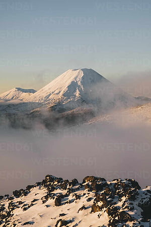 Mt Ngauruhoe stratovolcano rising above the mist down the valley at Tongariro National Park, New Zealand, HD phone wallpaper